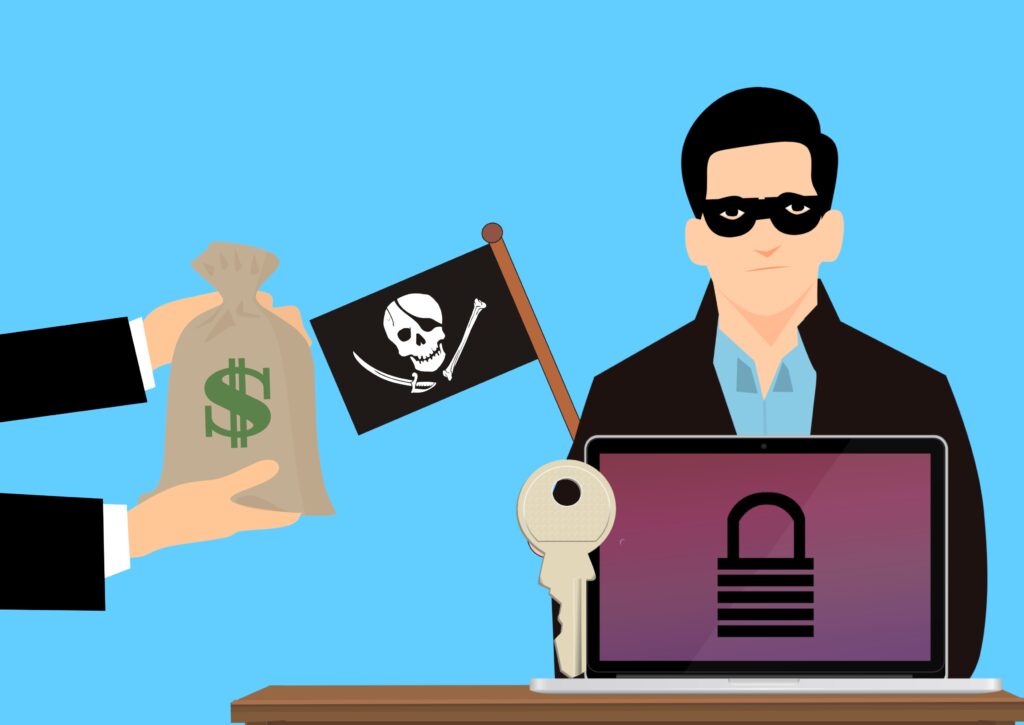 A hacker wearing a mask sits behind a laptop with a locked screen, displaying a flag with a skull, symbolising ransomware. A hand offers a bag of money, representing a ransom payment demand, highlighting the ransomware recovery process.