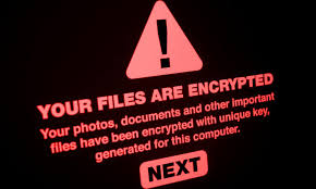 A ransomware message stating "Your files are encrypted" with a warning sign in red, urging the user to proceed with a recovery step.